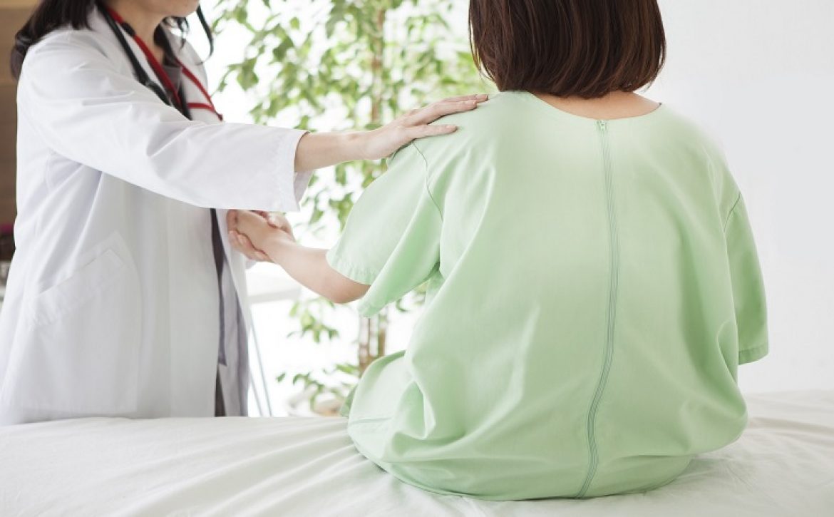 Doctor encouraging patient at hospital