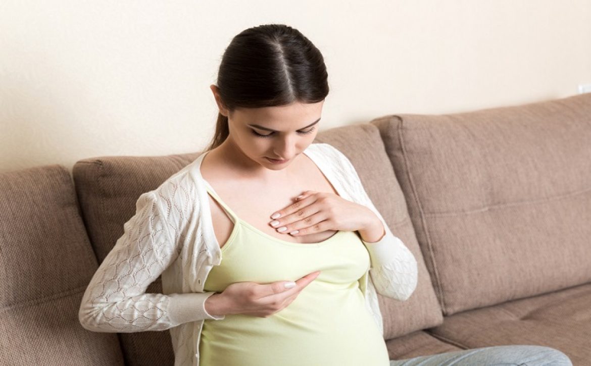 Pregnant,Girl,Checks,Her,Breasts.,Prevention,Of,Breast,Cancer.